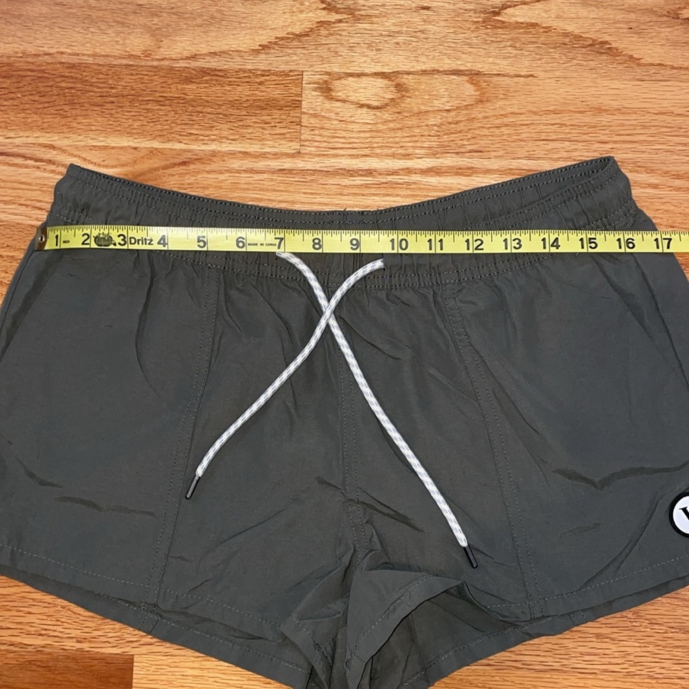 Vuori Women's Athletic Shorts in Army Green with White Drawstring